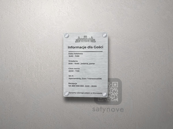 Srebrna tablica informacyjna dla gości z grafiką Warszawy