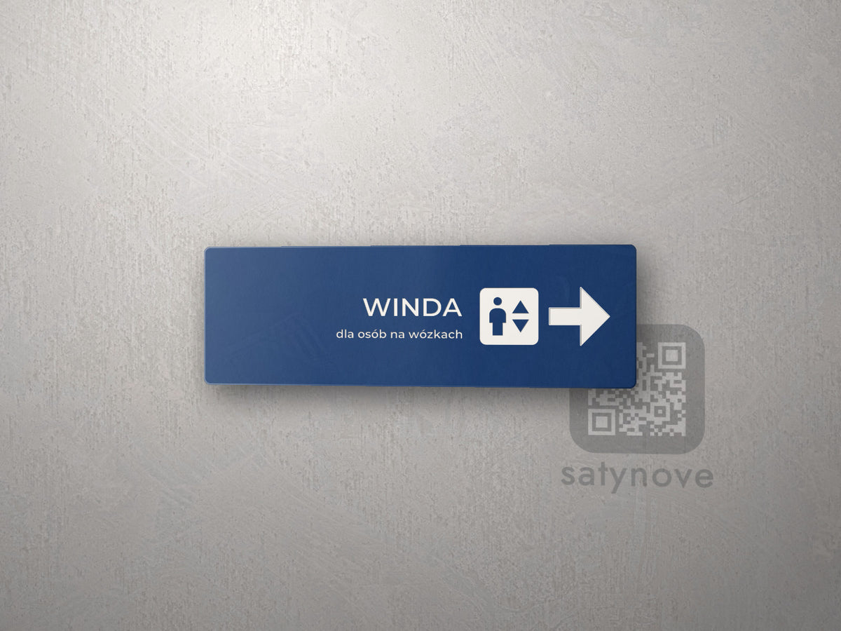 Granatowa tabliczka kierunkowa Winda z symbolem windy i strzałką w prawo