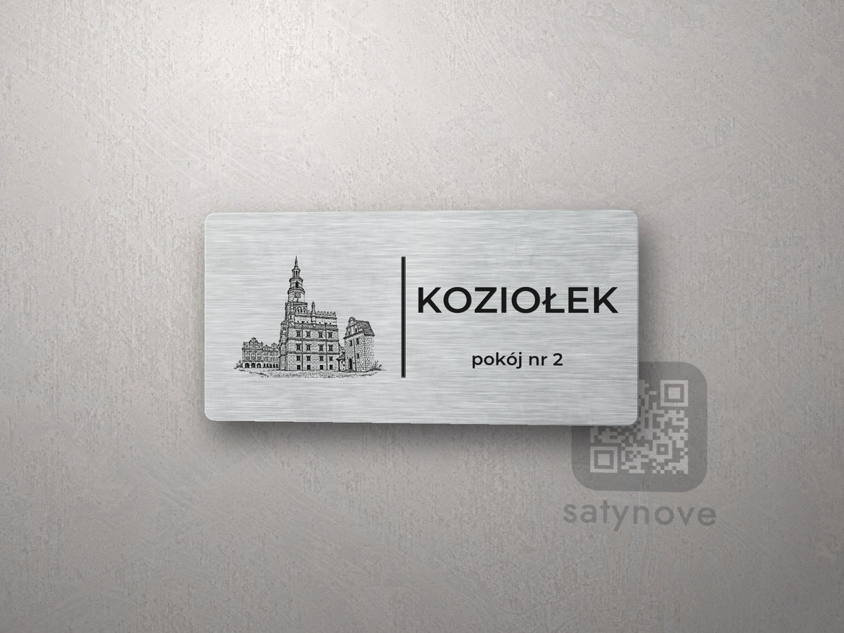 Srebrna tabliczka z rysunkiem i napisem KOZIOŁEK, pokój nr 2