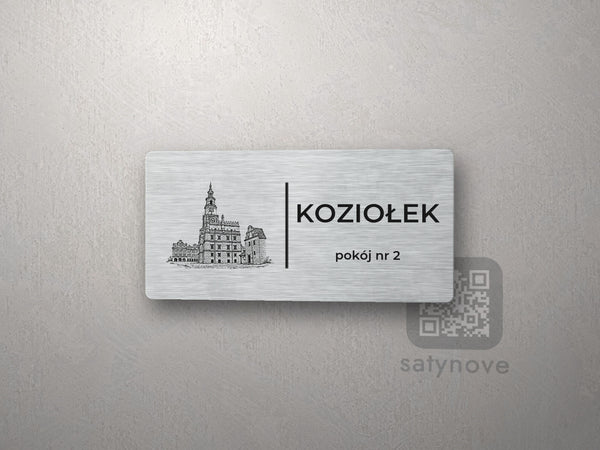Srebrna tabliczka z rysunkiem i napisem KOZIOŁEK, pokój nr 2