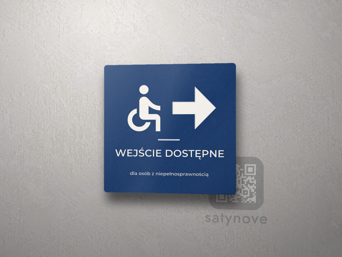Kwadratowa tabliczka z symbolem wózka, strzałką i napisem Wejście dostępne