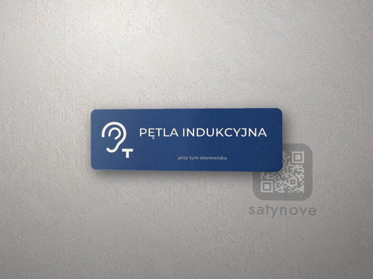 Mała granatowa tabliczka Pętla indukcyjna przy tym stanowisku z symbolem ucha i T
