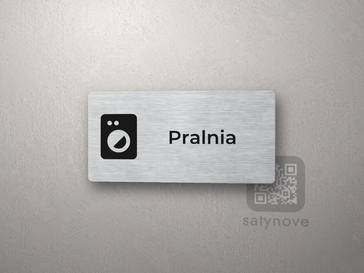 Srebrna tabliczka z piktogramem i napisem Pralnia
