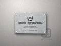Tablica jubileuszowa z wieńcem laurowym i liczbą 25, tytułem i dedykacją kursywą