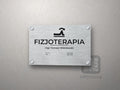 Tabliczka Fizjoterapia z symbolem