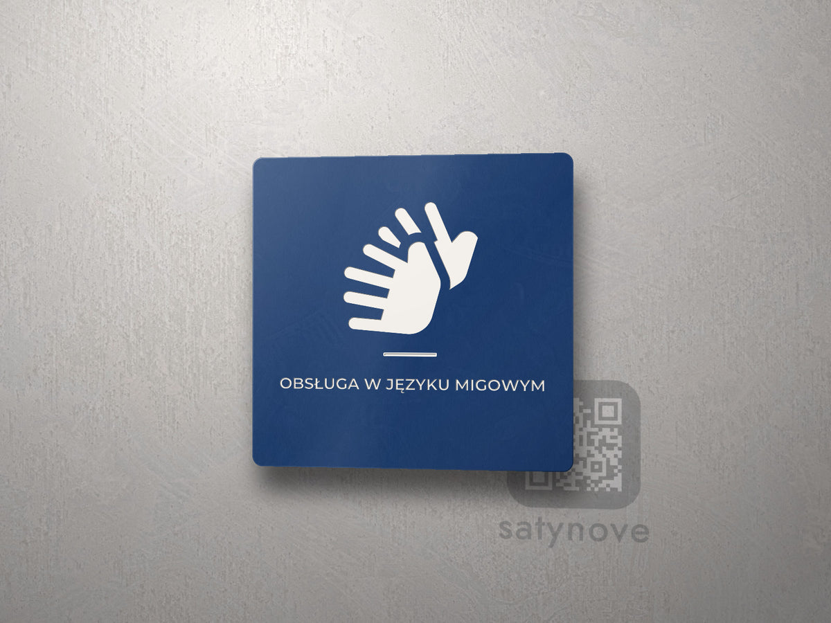 Granatowa tabliczka z symbolem języka migowego i napisem Obsługa w języku migowym