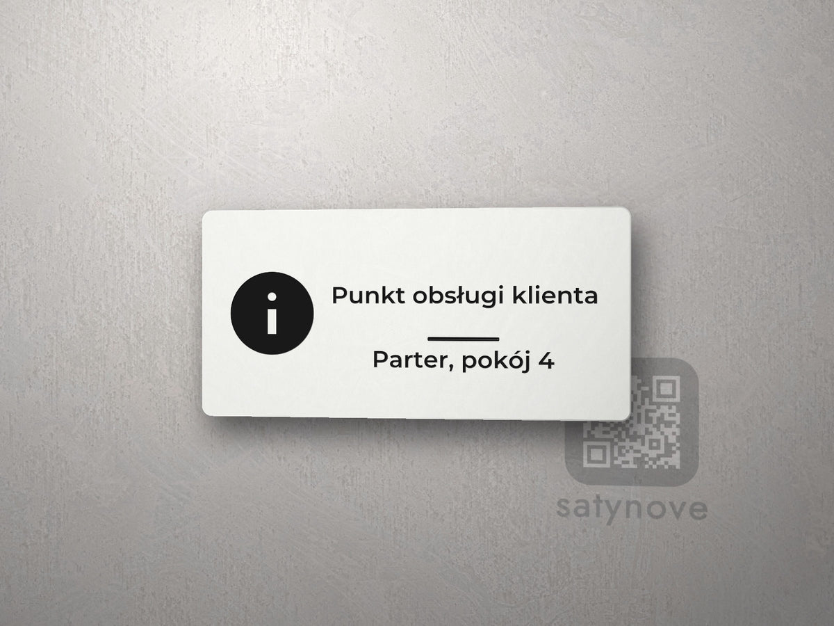 Biała tabliczka z symbolem informacji i napisem „Punkt obsługi klienta”