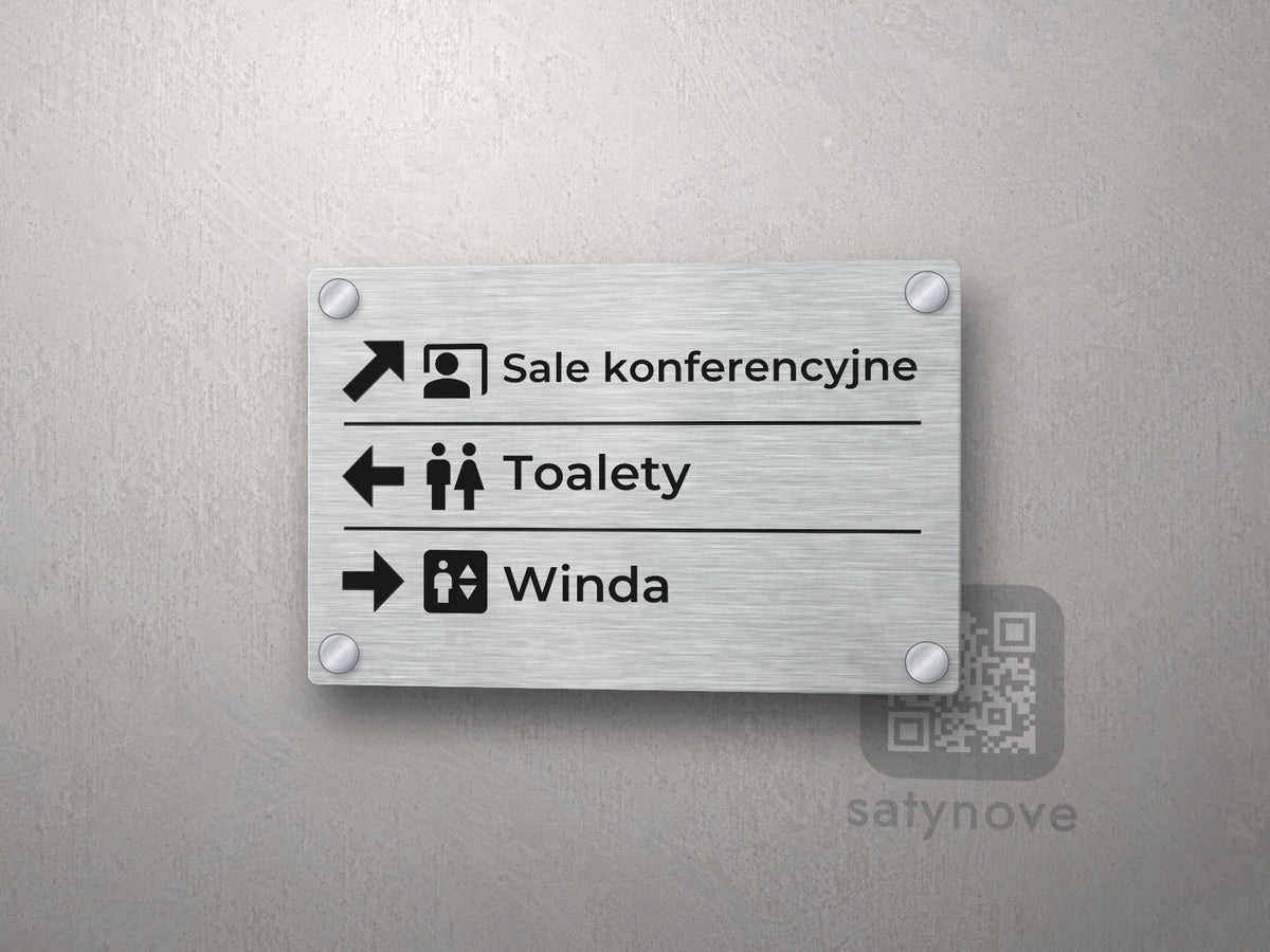 Tabliczka kierunkowa z trzema wierszami: strzałka, piktogram i nazwa