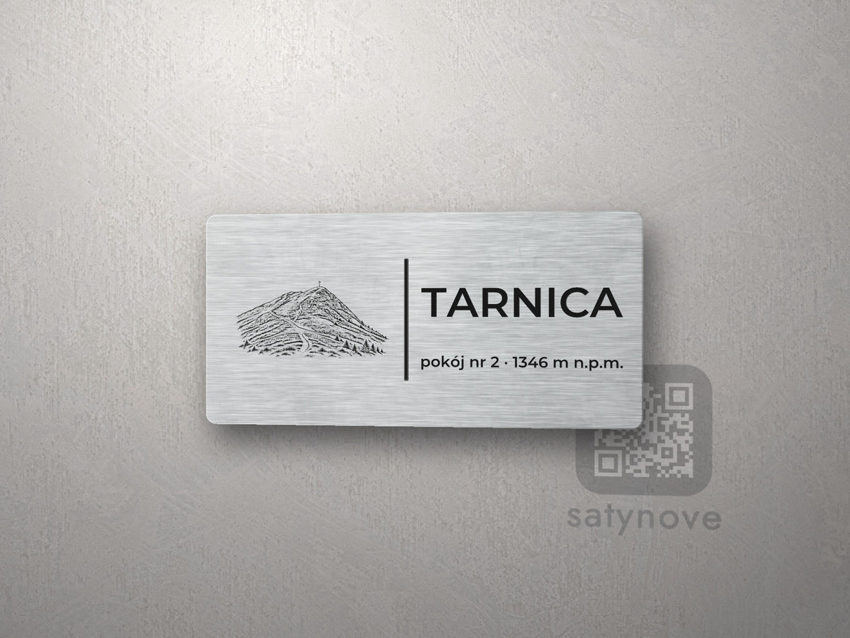 Srebrna tabliczka z rysunkiem i napisem TARNICA, pokój nr 2