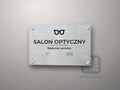 Tabliczka Salon optyczny z symbolem