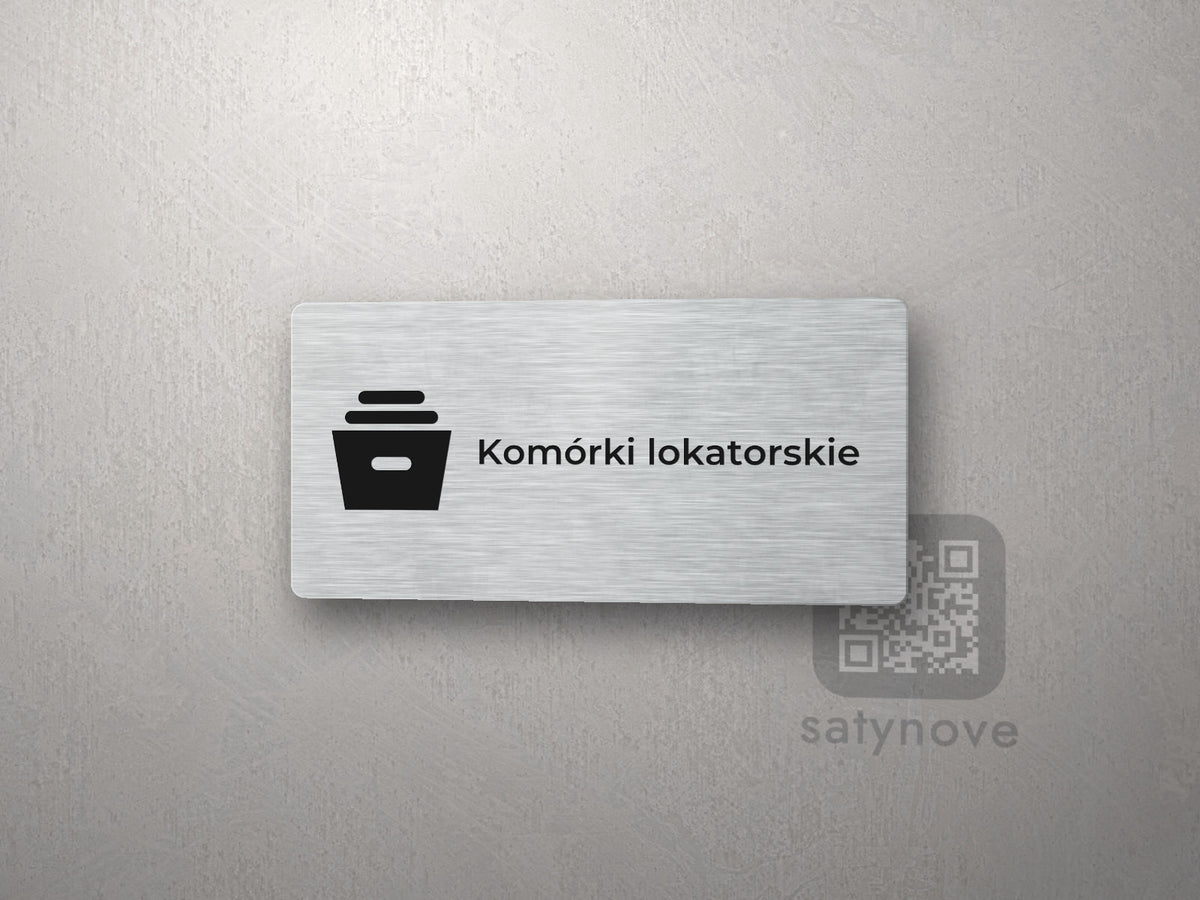 Srebrna tabliczka z piktogramem i napisem Komórki lokatorskie