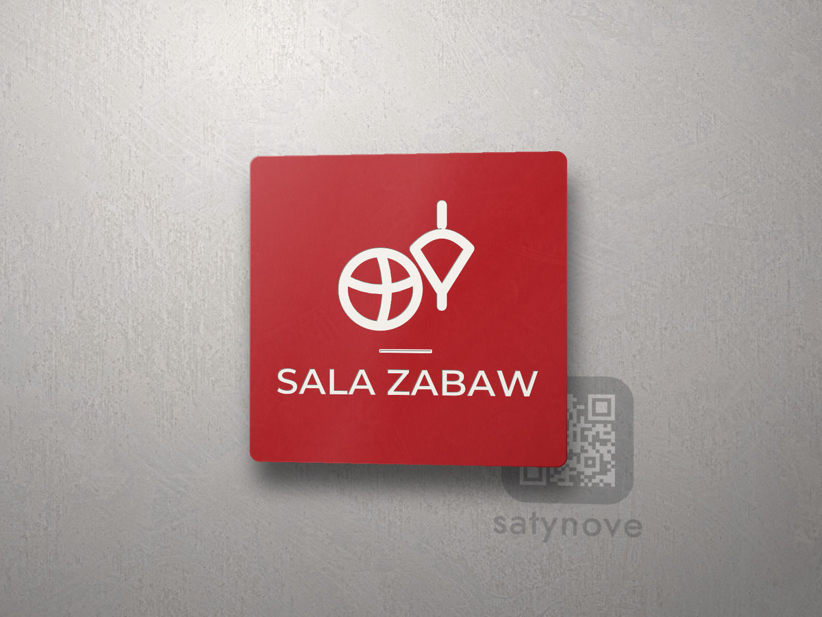 Czerwona kwadratowa tabliczka z obrazkiem i napisem SALA ZABAW