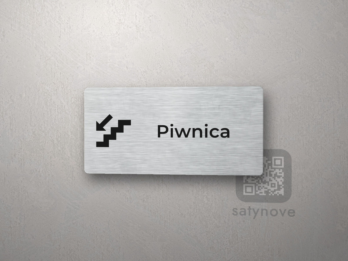 Srebrna tabliczka z piktogramem i napisem Piwnica